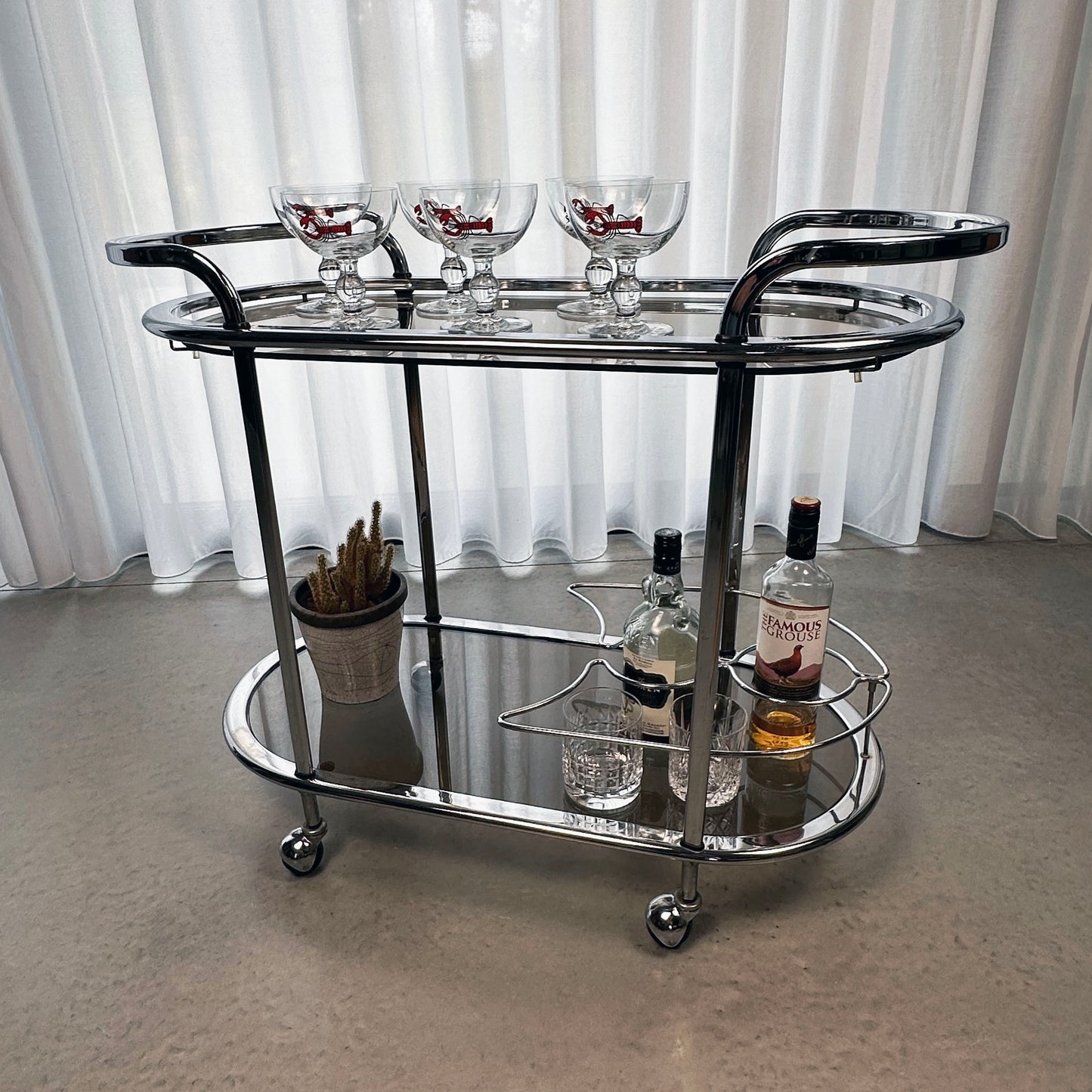 Vintage 70s chrome and glass bar cart